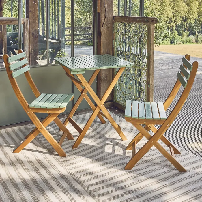 sweeek - Acacia wood garden table 2 folding chairs Hilora Sage Green 60x60x8 cm