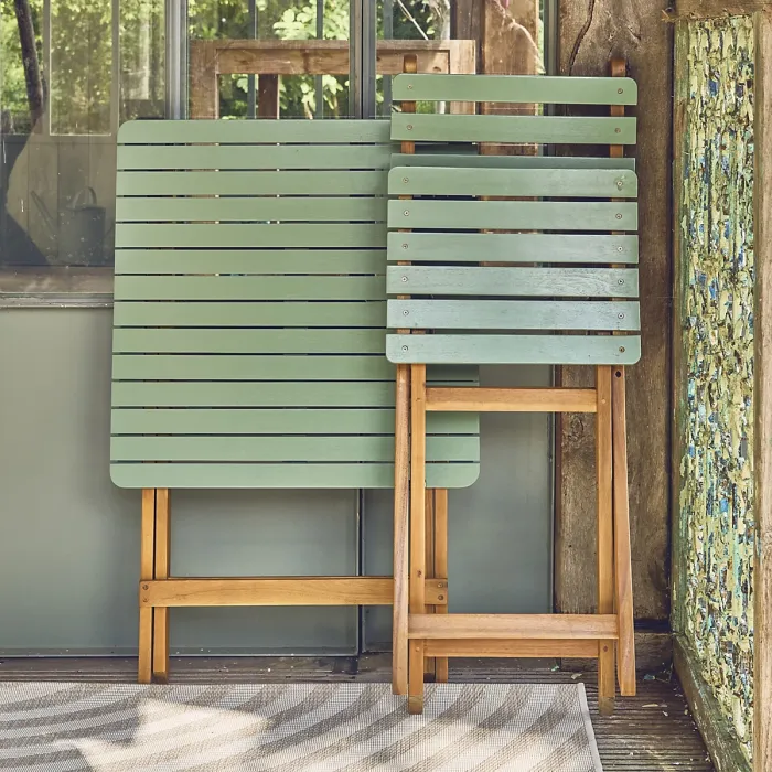sweeek - Acacia wood garden table 2 folding chairs Hilora Sage Green 60x60x8 cm